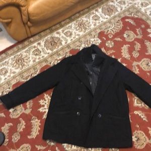 Pea Coat coat has inside zipper and funnel neck.